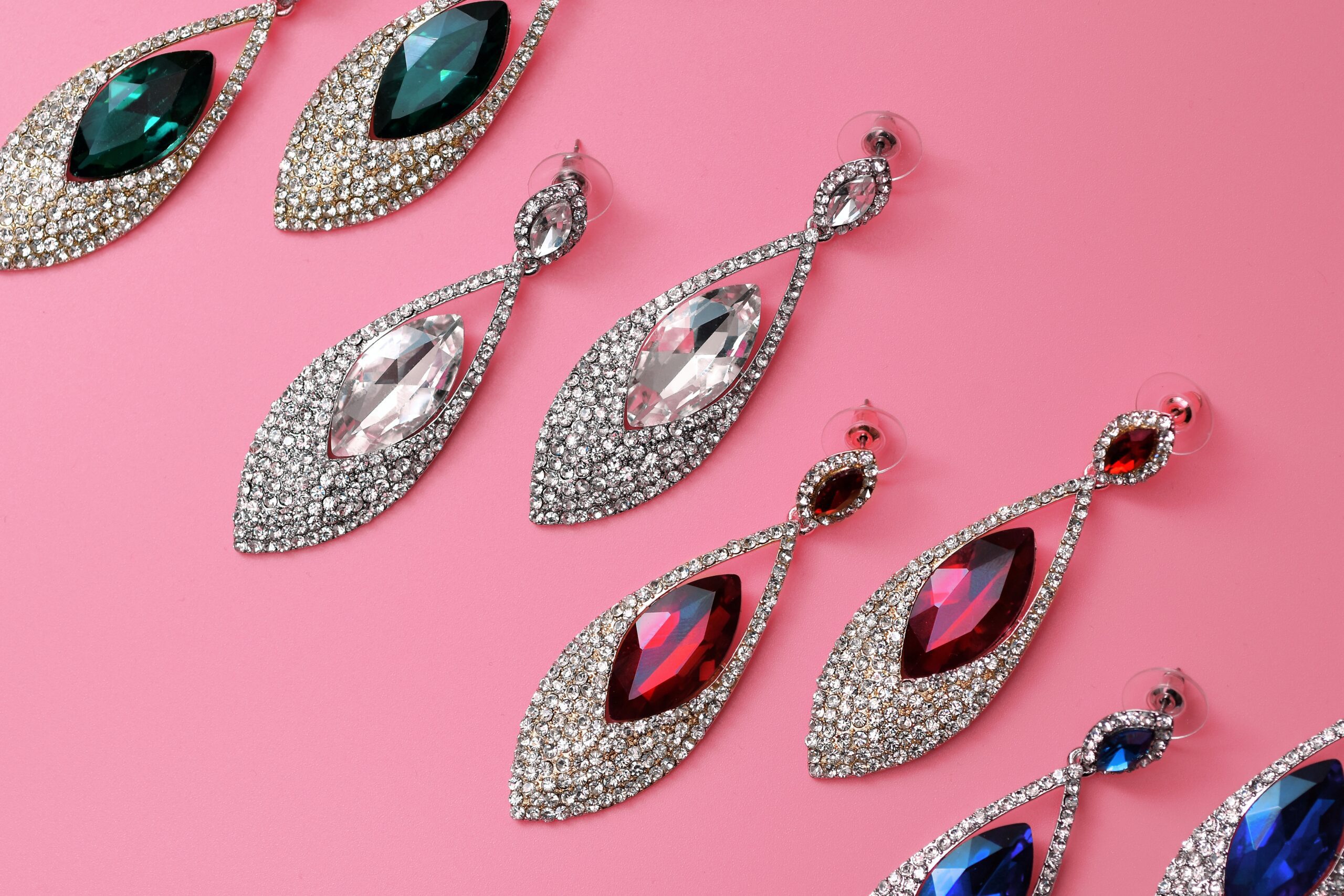 Silver and diamond earrings on display