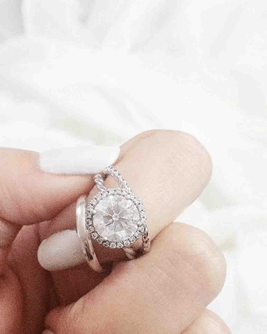 woman's finger with a ring on