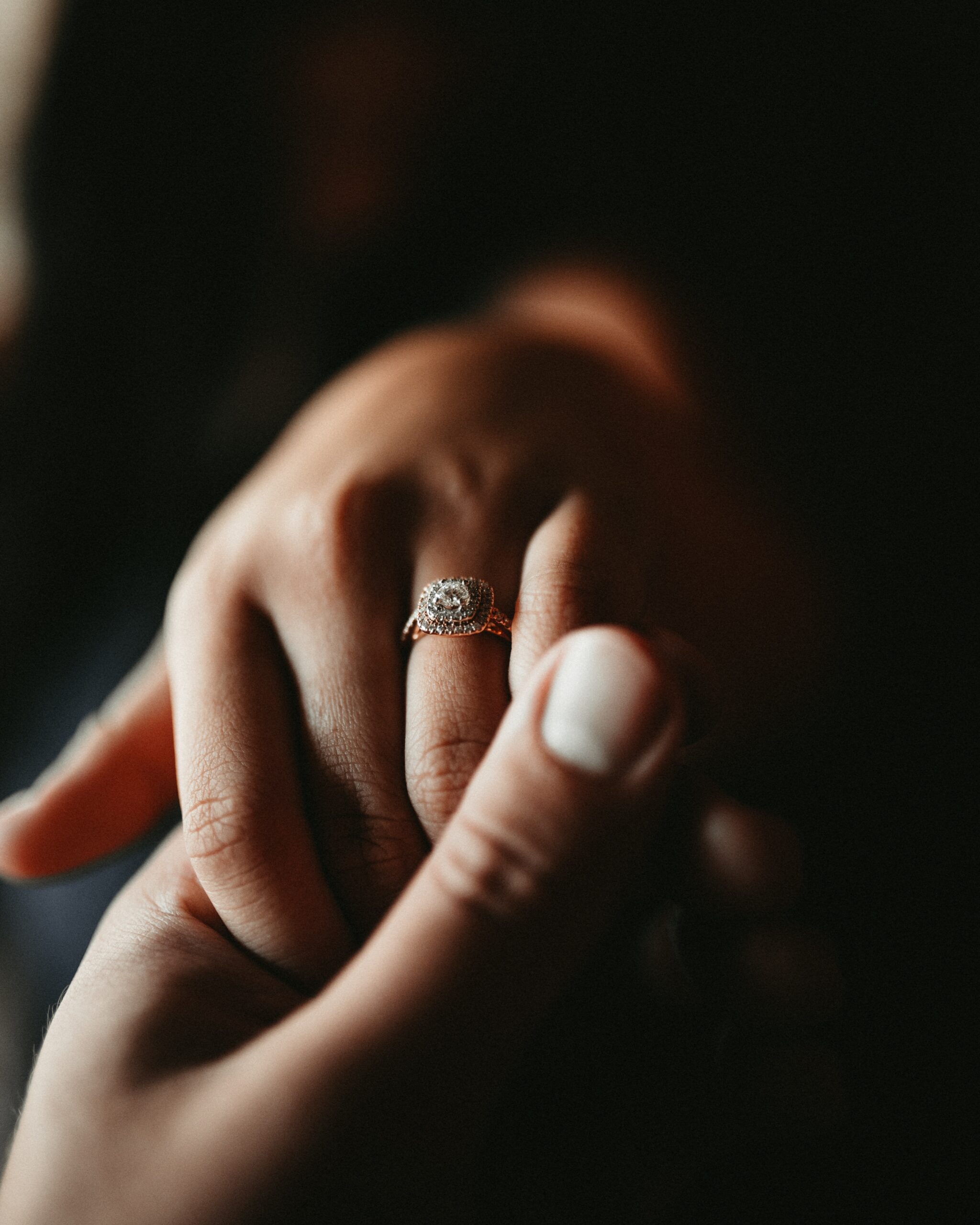 Person wearing a silver diamond ring
