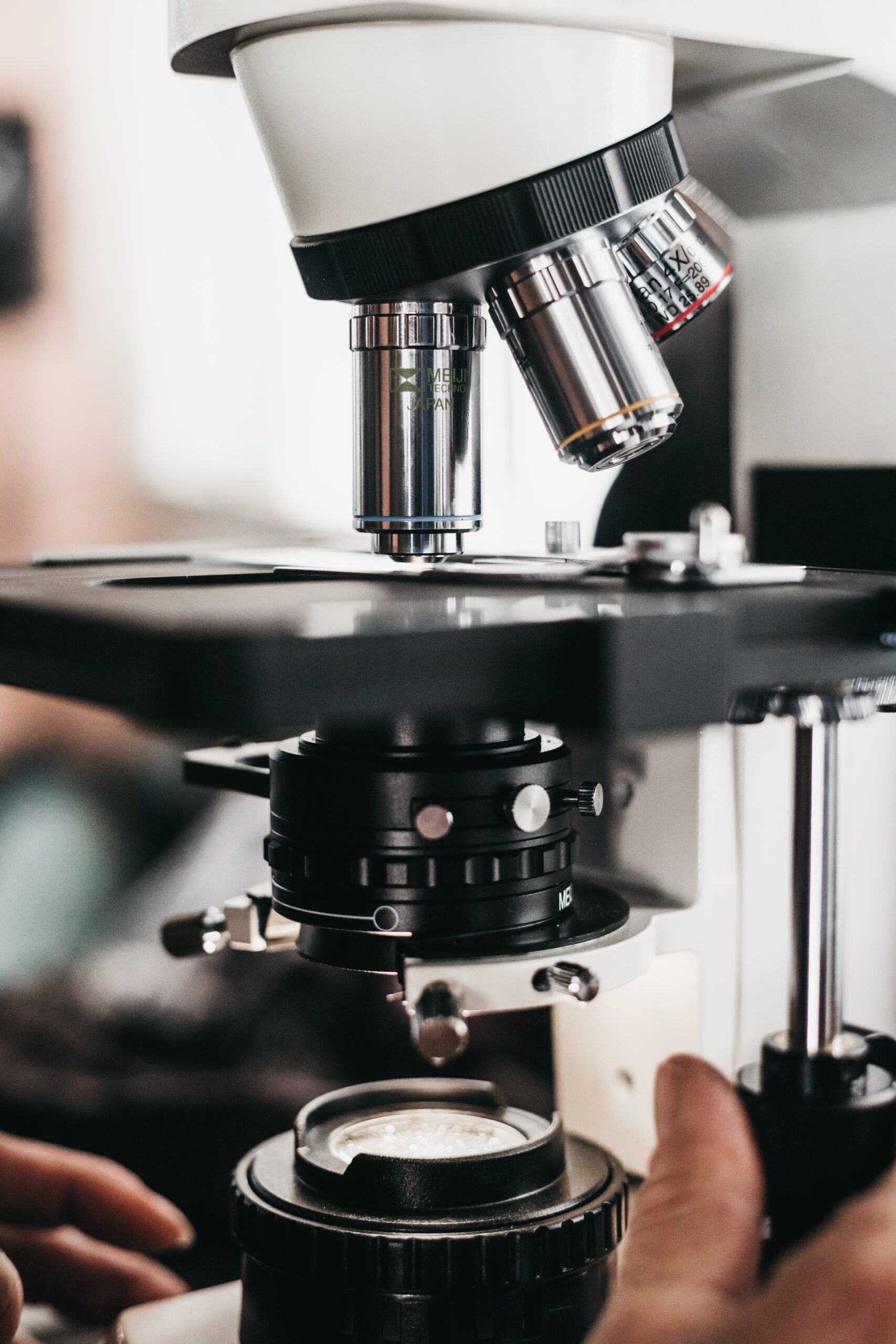 Person using a microscope in a lab