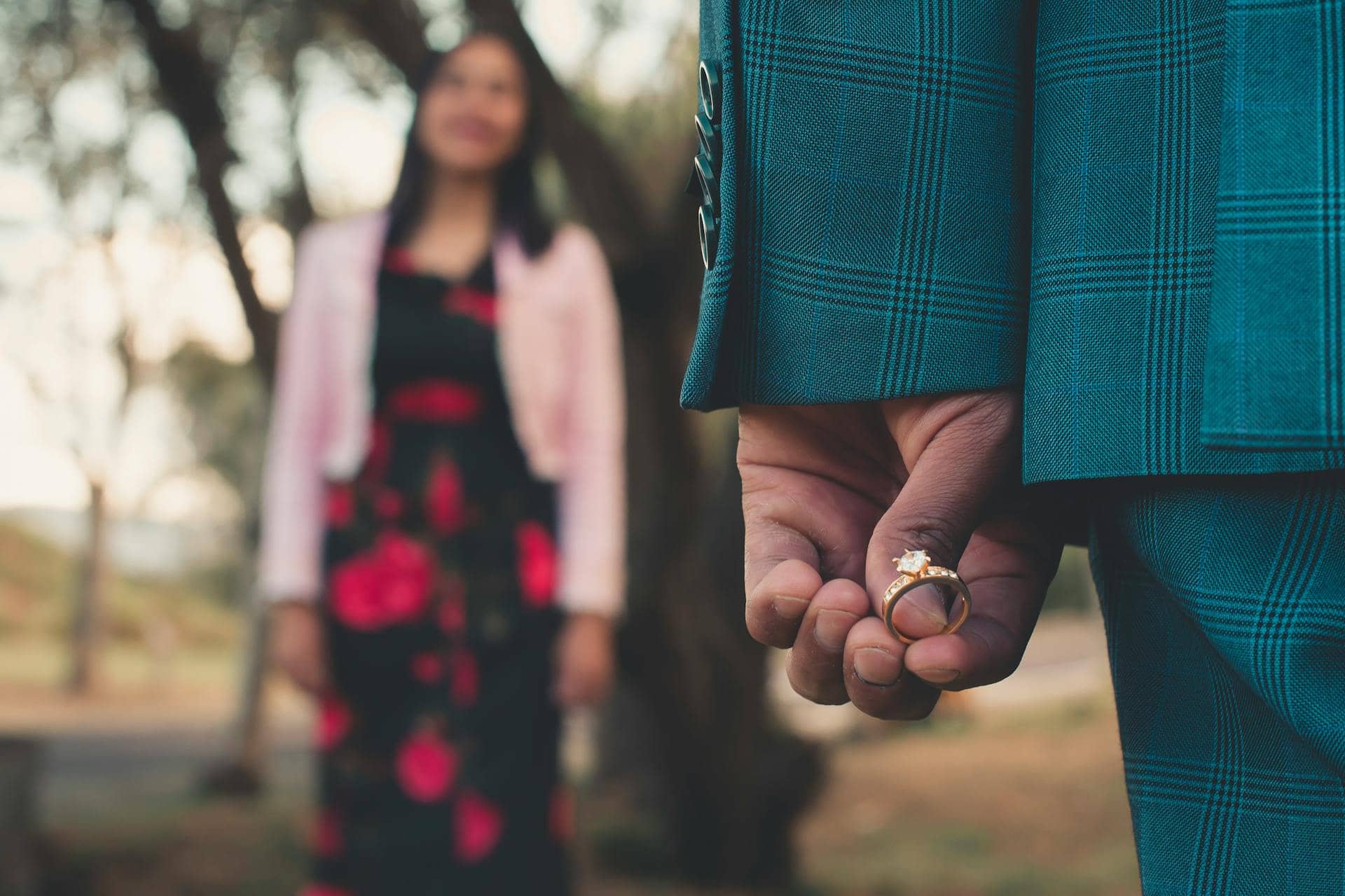 Man hiding an engagement ring