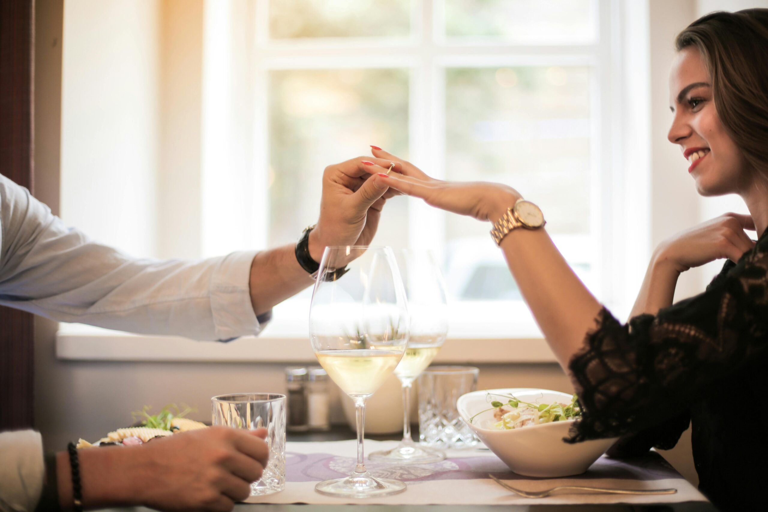 Man looking at a ring on a finger