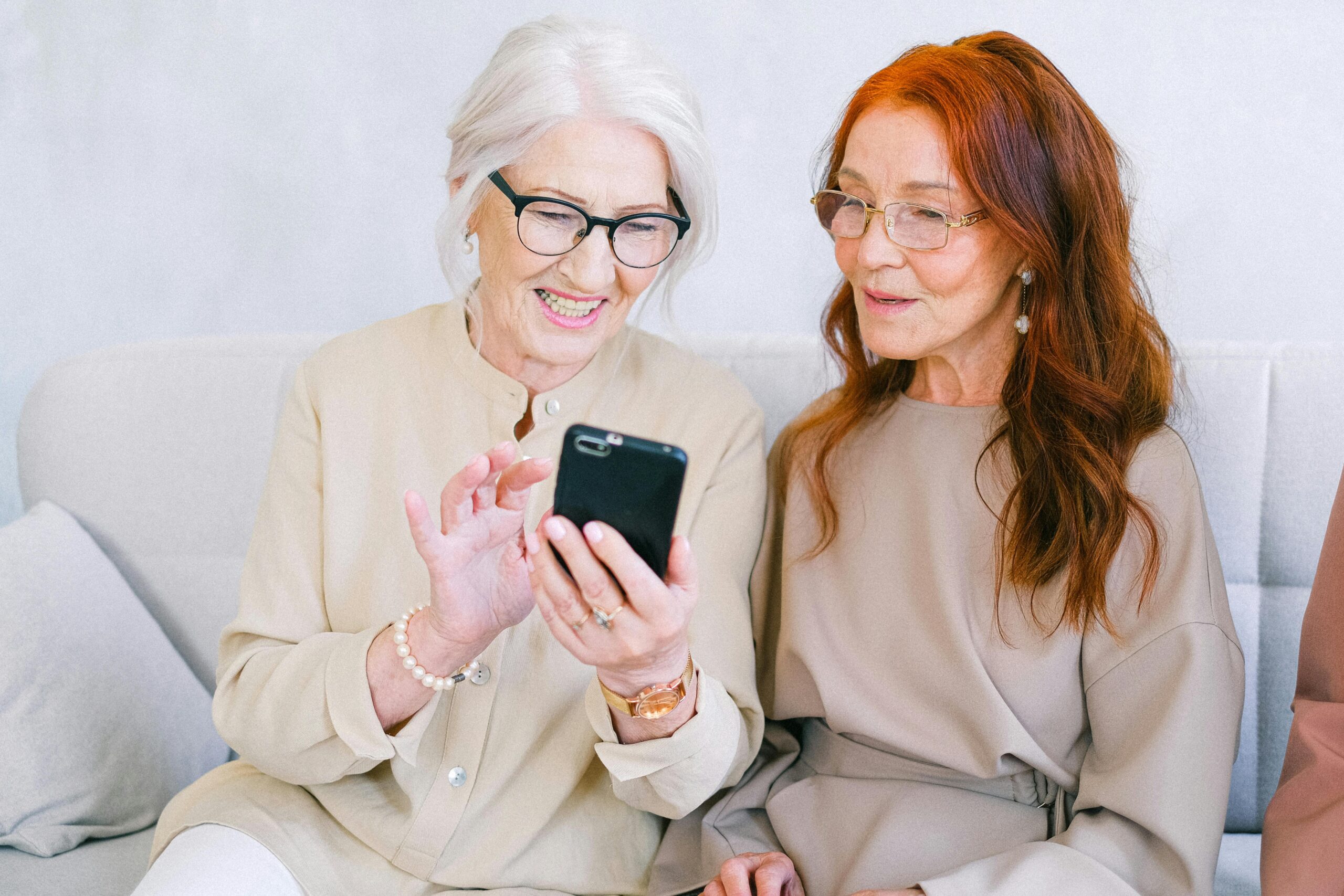 Cheerful Senior Women Shopping Online