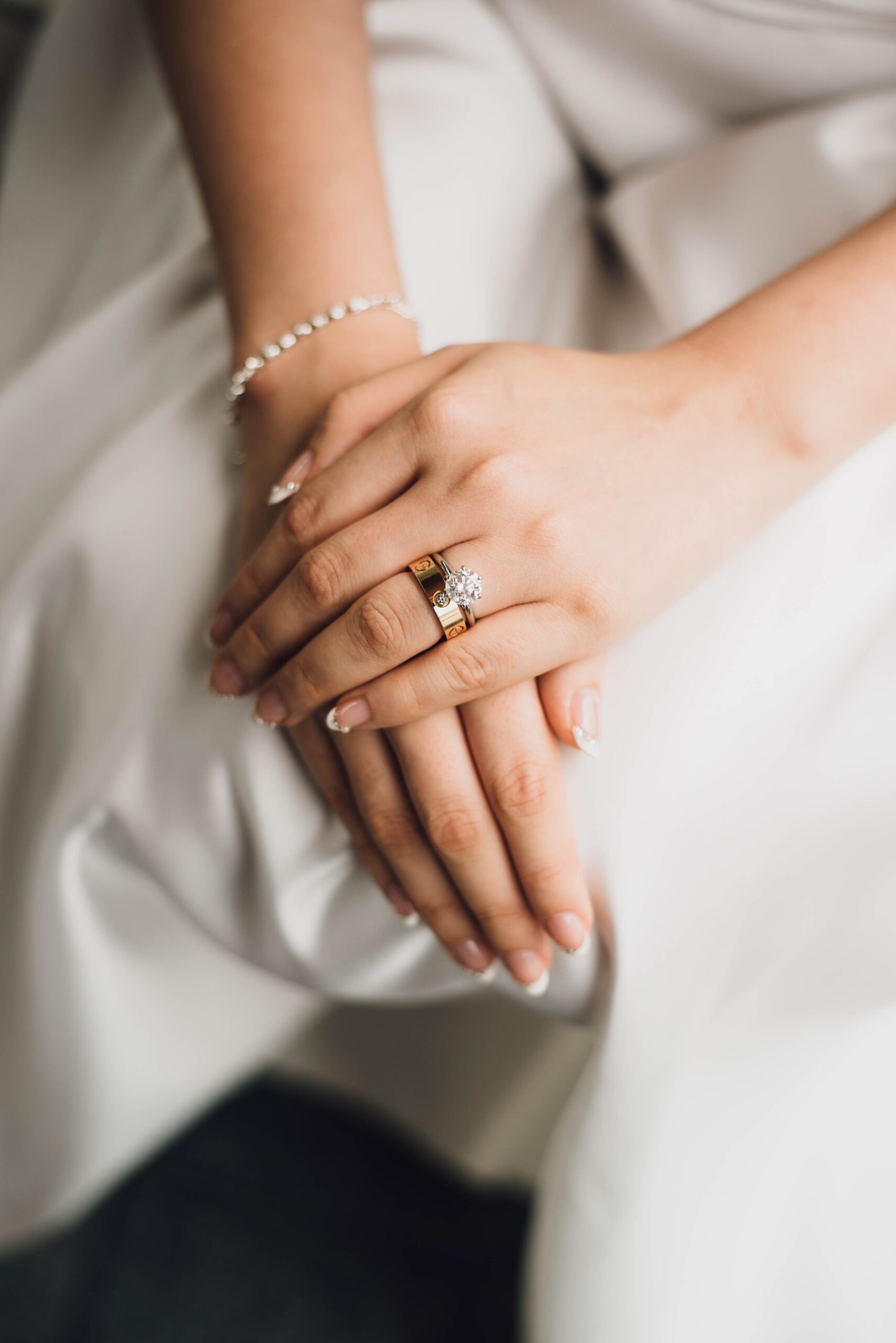 A woman in a white dress wearing wedding jewellery